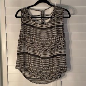 Sleeveless black and white silky shirt